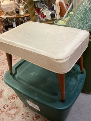 Vintage Mid-Century Vinyl Footstool with Tapered Legs and Unique Design on Top