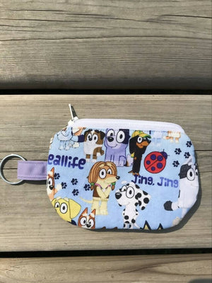 Zippered Coin Purse Ear Bud Holder - Blue Background With Cartoon Dogs - Drinkle Mall Location Only