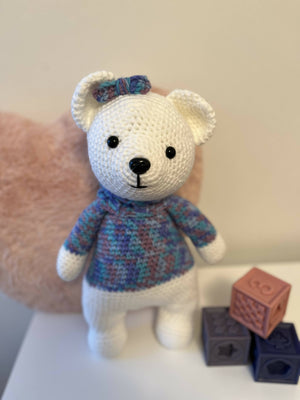 Crochet white bear with purple and blue sweater