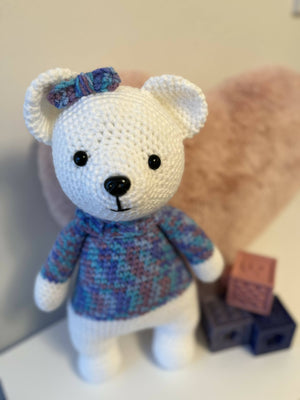 Crochet white bear with purple and blue sweater
